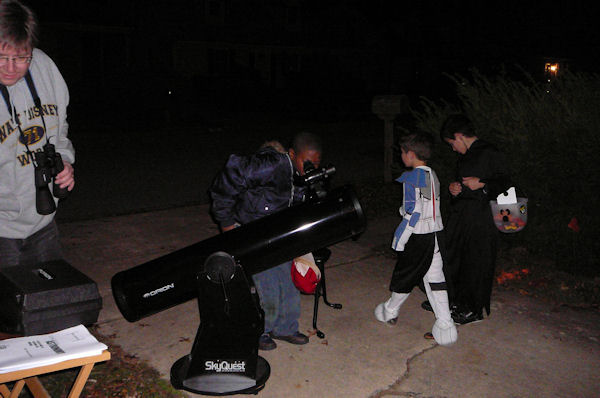 Sidewalk Astronomy - Halloween 2008
Approx 50 kids and parents looked through XT8 Dob at Jupiter and NGC 457. 

